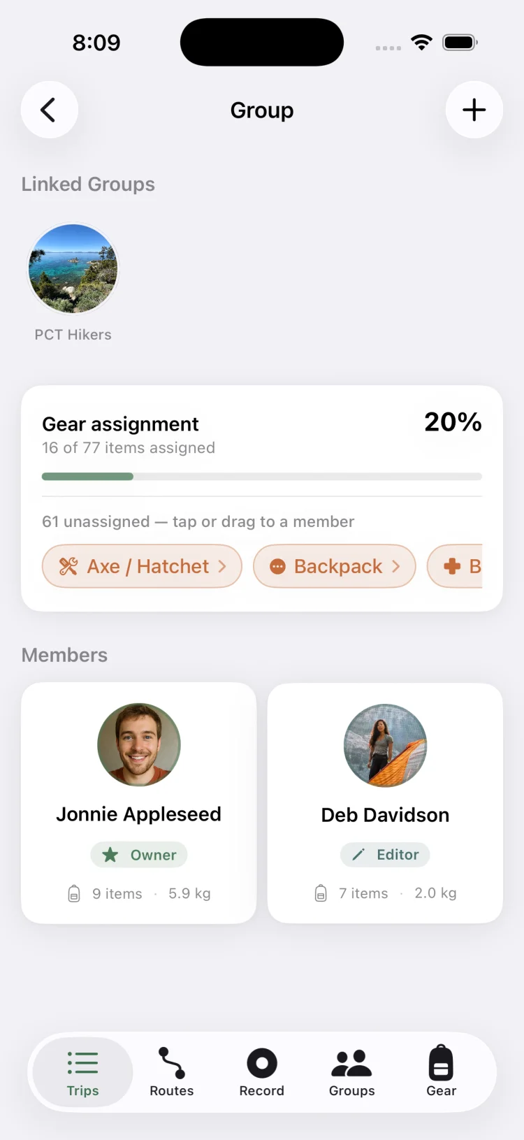 GoVenture group screen showing gear assignment progress at twenty percent with unassigned items and two trip members with their carried weight